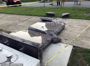 The new Ten Commandments monument outside the state Capitol in Little Rock, Ark., is blocked off Wednesday morning, June 28, 2017, after someone crashed into it with a vehicle, less than 24 hours after the privately funded monument was installed on the Capitol grounds. Authorities arrested a male suspect. (AP Photo/Jill Zeman Bleed)